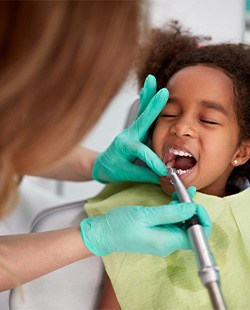 Little girl having teeth cleaned